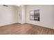 Comfortable living room with a bright window and neutral walls, offering a versatile space at 927 E Charleston Ave, Phoenix, AZ 85022