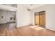 Open living room with a sliding glass door and modern ceiling fan, offers access to outdoor space at 927 E Charleston Ave, Phoenix, AZ 85022