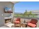 Relaxing balcony with comfortable seating, a fireplace, and picturesque outdoor views at 945 E Playa Del Norte Dr # 3009, Tempe, AZ 85288