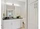 Well lit bathroom featuring white cabinets, granite countertops and modern hardware at 945 E Playa Del Norte Dr # 3009, Tempe, AZ 85288