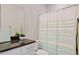 Bathroom featuring granite countertop and a shower curtain with modern design at 945 E Playa Del Norte Dr # 3009, Tempe, AZ 85288