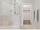 Clean bathroom featuring a glass-enclosed shower and a separate soaking tub and walk in closet at 945 E Playa Del Norte Dr # 3009, Tempe, AZ 85288