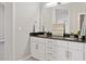 Modern bathroom features double vanity with granite countertop and a large mirror at 945 E Playa Del Norte Dr # 3009, Tempe, AZ 85288