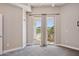 Bright bedroom with neutral walls and carpet, leading to a private balcony with outdoor seating at 945 E Playa Del Norte Dr # 3009, Tempe, AZ 85288