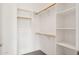 Bright closet with shelves and wooden closet rods for ample storage at 945 E Playa Del Norte Dr # 3009, Tempe, AZ 85288
