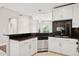 Modern kitchen featuring granite countertops, stainless steel appliances, and sleek white cabinets at 945 E Playa Del Norte Dr # 3009, Tempe, AZ 85288