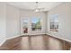 Bright living room with wood floors, ceiling fan, and a balcony perfect for relaxation at 945 E Playa Del Norte Dr # 3009, Tempe, AZ 85288