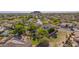 Wide shot featuring homes with pools, greenery, and community landscaping in a suburban setting at 9661 E Glencove Cir, Mesa, AZ 85207