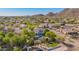 Beautiful aerial view featuring a home with a private pool, mature landscaping, and mountain views at 9661 E Glencove Cir, Mesa, AZ 85207