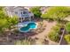 Gorgeous backyard oasis with a freeform pool, inviting patio area, and meticulously maintained landscaping at 9661 E Glencove Cir, Mesa, AZ 85207