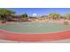 Community basketball court featuring well-maintained surface, hoops, and benches for recreational games and exercise at 9661 E Glencove Cir, Mesa, AZ 85207