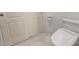 Close up of toilet and bidet in white tiled bathroom at 9661 E Glencove Cir, Mesa, AZ 85207