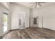 Spacious bedroom with wood floors and open doorway to other rooms at 9661 E Glencove Cir, Mesa, AZ 85207