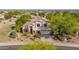Inviting two-story home showcasing mature landscaping and a tile roof at 9661 E Glencove Cir, Mesa, AZ 85207