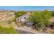 Beautiful home with a tile roof, lush landscaping, and a two-car garage at 9661 E Glencove Cir, Mesa, AZ 85207