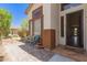Inviting front porch with decorative tile, bench seating, and views of desert landscape at 9661 E Glencove Cir, Mesa, AZ 85207