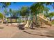Playground equipment with slides and climbing structures nestled in a community park, promising fun and adventure at 9661 E Glencove Cir, Mesa, AZ 85207