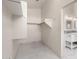 Walk-in closet with tile flooring and basic shelving at 9661 E Glencove Cir, Mesa, AZ 85207