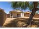 A gravel backyard features a covered patio, providing a private outdoor space at 9717 W Purdue Ave, Peoria, AZ 85345