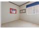 Bedroom with neutral colored walls and carpet at 9717 W Purdue Ave, Peoria, AZ 85345