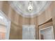 Entryway with dome ceiling and decorative light fixture at 9717 W Purdue Ave, Peoria, AZ 85345