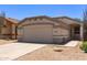 Charming single-story home featuring a two-car garage, desert landscaping, and a welcoming facade at 9717 W Purdue Ave, Peoria, AZ 85345