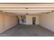 The garage features built-in cabinets, plenty of storage, and a clean concrete floor at 9717 W Purdue Ave, Peoria, AZ 85345