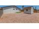 Backyard with partial rock ground cover, block fence, storage shed, and easy access to the home at 9801 N 56Th Dr, Glendale, AZ 85302
