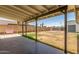 Large, shaded backyard with a covered patio, multiple swingsets, and plenty of room to play at 9801 N 56Th Dr, Glendale, AZ 85302