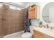 A full bathroom features updated fixtures and finishes, plus storage cabinets at 9801 N 56Th Dr, Glendale, AZ 85302