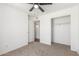 This comfortable bedroom features neutral carpeting and a closet for storage at 9801 N 56Th Dr, Glendale, AZ 85302