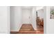 Inviting foyer with warm wood flooring and direct access to the dining room at 9801 N 56Th Dr, Glendale, AZ 85302