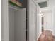 Hallway features a closet with storage and a view of the bathroom and bedroom at 9801 N 56Th Dr, Glendale, AZ 85302