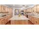 Bright kitchen features stainless appliances, wood floors and a large island with stylish countertop at 9801 N 56Th Dr, Glendale, AZ 85302