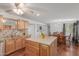 Bright kitchen features stainless appliances, wood floors and a large island with stylish countertop at 9801 N 56Th Dr, Glendale, AZ 85302