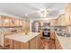Bright kitchen features stainless appliances, wood floors and a large island with stylish countertop at 9801 N 56Th Dr, Glendale, AZ 85302