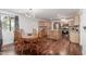 A bright kitchen dining area features a wooden dining set with a kitchen with a center island at 9801 N 56Th Dr, Glendale, AZ 85302