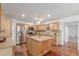 Bright kitchen features stainless appliances, wood floors and a large island with stylish countertop at 9801 N 56Th Dr, Glendale, AZ 85302
