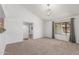 Bright living room with vaulted ceiling, neutral carpet, and a large window with pleasant views at 9801 N 56Th Dr, Glendale, AZ 85302
