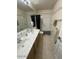 Bathroom featuring double sinks with a shower-tub combo with grab bars at 1038 S Palomino Creek Dr, Gilbert, AZ 85296