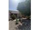 Well-maintained front yard with desert landscaping and mature trees at 1038 S Palomino Creek Dr, Gilbert, AZ 85296