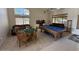 Entertainer's dream game room with pool table, card table and seating at 1038 S Palomino Creek Dr, Gilbert, AZ 85296