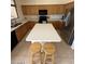 Bright kitchen with island, white countertops, and stainless steel appliances at 1038 S Palomino Creek Dr, Gilbert, AZ 85296