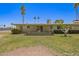 Spacious backyard with covered patio and lush greenery in a desirable neighborhood at 10702 W Salem Dr, Sun City, AZ 85351