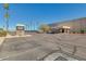 Commercial building in a community with street sign and parking spaces at 10702 W Salem Dr, Sun City, AZ 85351