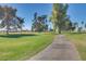 Scenic view of a meticulously maintained golf course with lush green fairways and mature trees at 10702 W Salem Dr, Sun City, AZ 85351