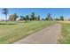 Scenic view of a meticulously maintained golf course with lush green fairways and mature trees at 10702 W Salem Dr, Sun City, AZ 85351