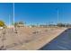 Beautifully maintained lawn bowling area with benches for relaxing and socializing at 10702 W Salem Dr, Sun City, AZ 85351