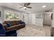 Spacious living room with large window providing ample natural light and inviting atmosphere at 10702 W Salem Dr, Sun City, AZ 85351