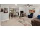 Open living room showcasing seamless transition to the dining area and kitchen at 10702 W Salem Dr, Sun City, AZ 85351